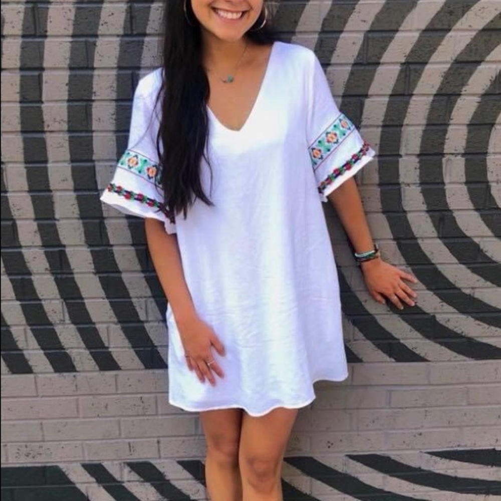 Boutique white embroidered dress with pockets